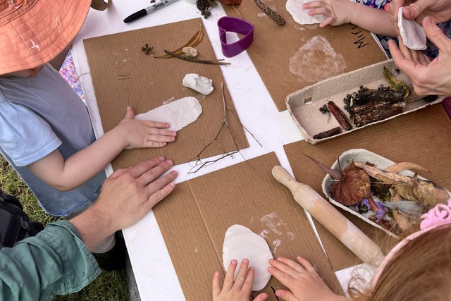 Children taking part in a nature activity at Environment House